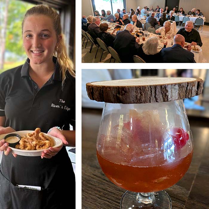 A waitress serves food as a group dines at Marinette Restaurant, cocktail on wood slice garnish.