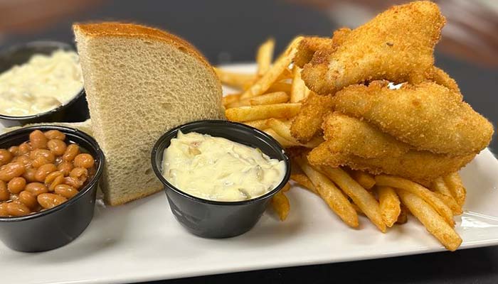 Plate with fried fish, French fries, baked beans, and bread at Marinette Restaurant & Event Venue.